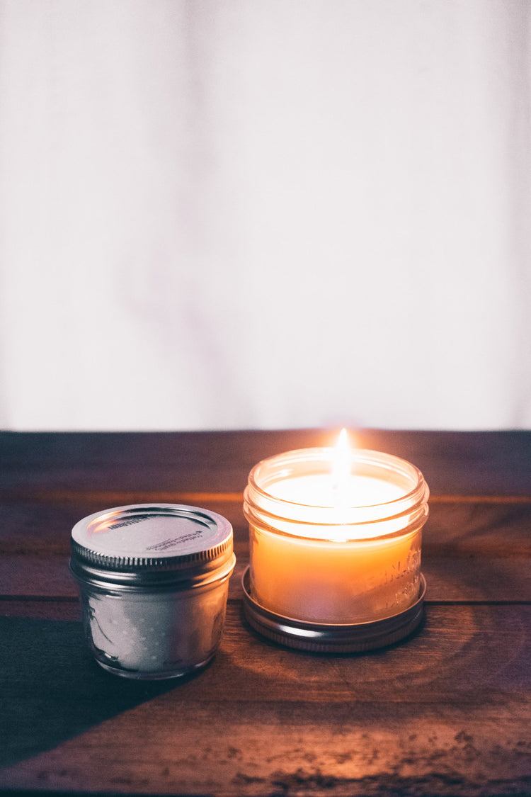 Candles product photography dry sand, earthen brown, and weathered terracotta