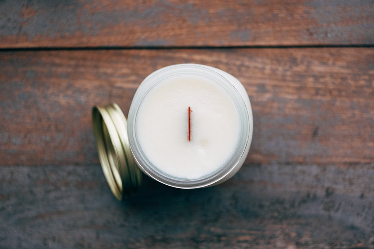 Candles product photography dry sand, earthen brown, and weathered terracotta